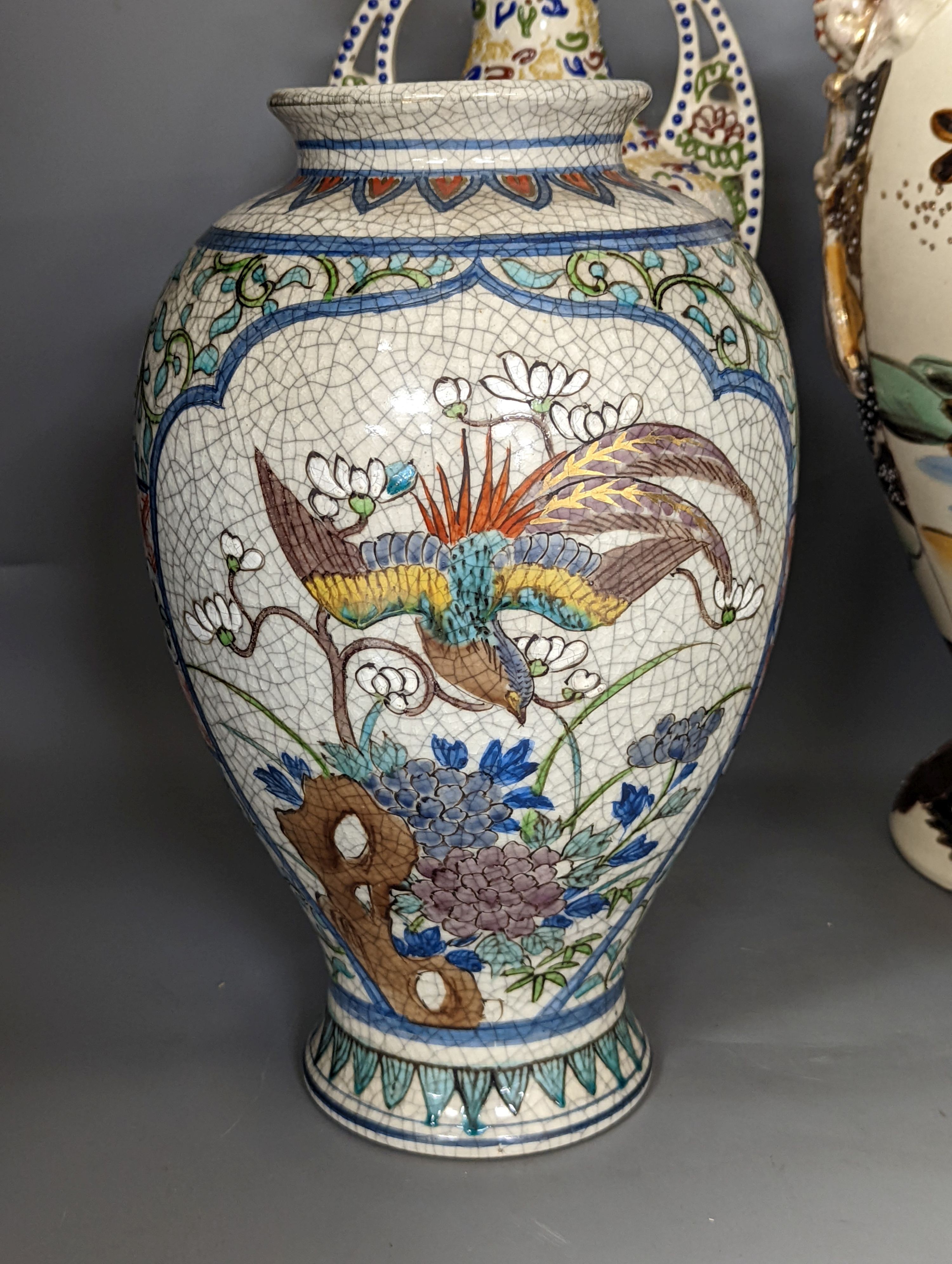 A pair of Japanese crackle ware vases, a lidded vase and 2 others, tallest 60 cms high.